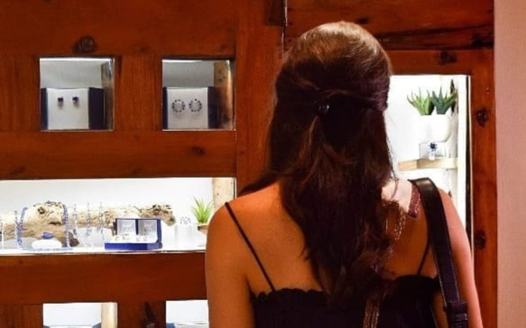 Woman looking to buy Tanzanite at The Tanzanite Experience Shop