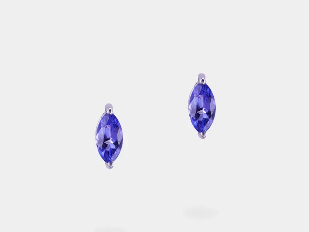Exquisite Tanzanite studs, offering a glimpse of Tanzanian luxury with their deep blue tones and flawless design