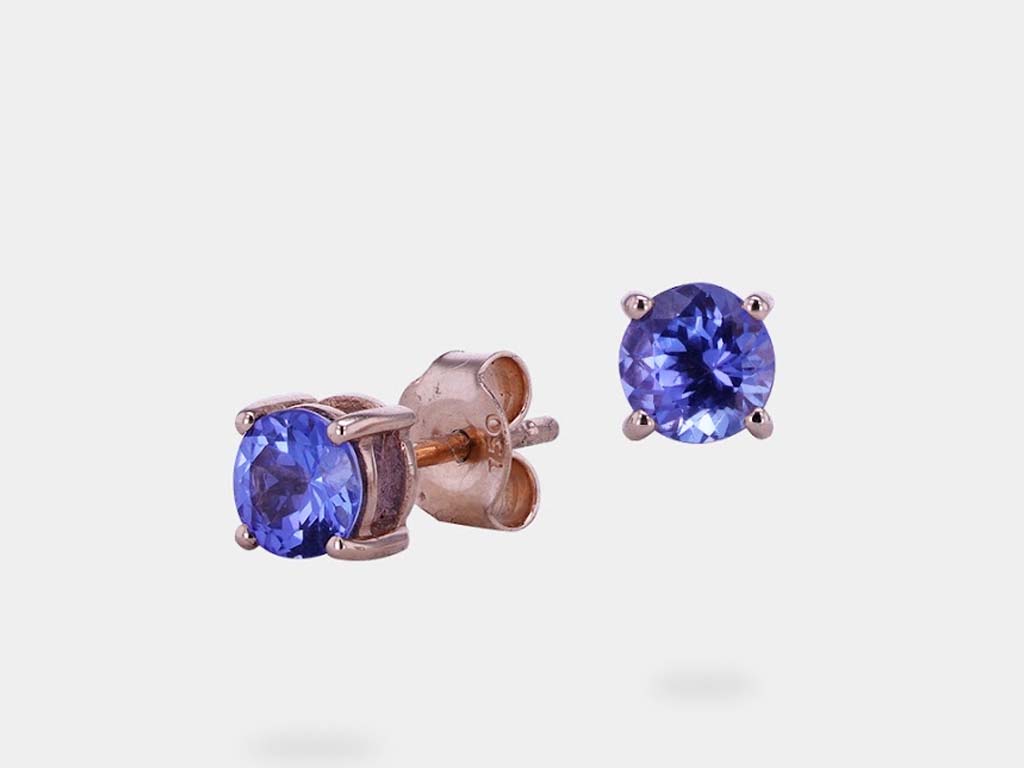 Timeless blue Tanzanite earring studs, combining the vibrant color of Tanzanite with a classic style, a perfect addition to any jewelry collection.